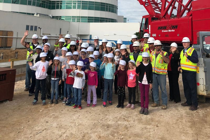 School field trip touring a Robins and Morton construction site