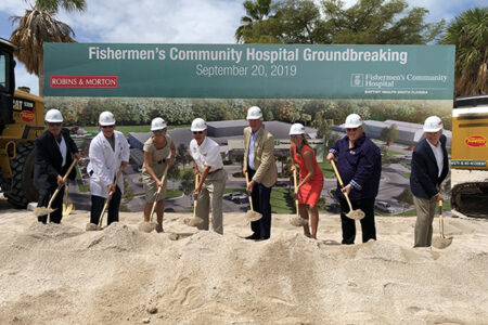 people breaking ground on a hospital